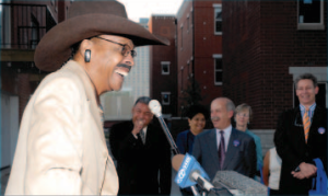Herbert Rogers Kent, the "Honorary Mayor of Bronzeville, jokes with the audience at the Eastgate Village street dedication in the fall of 2007.